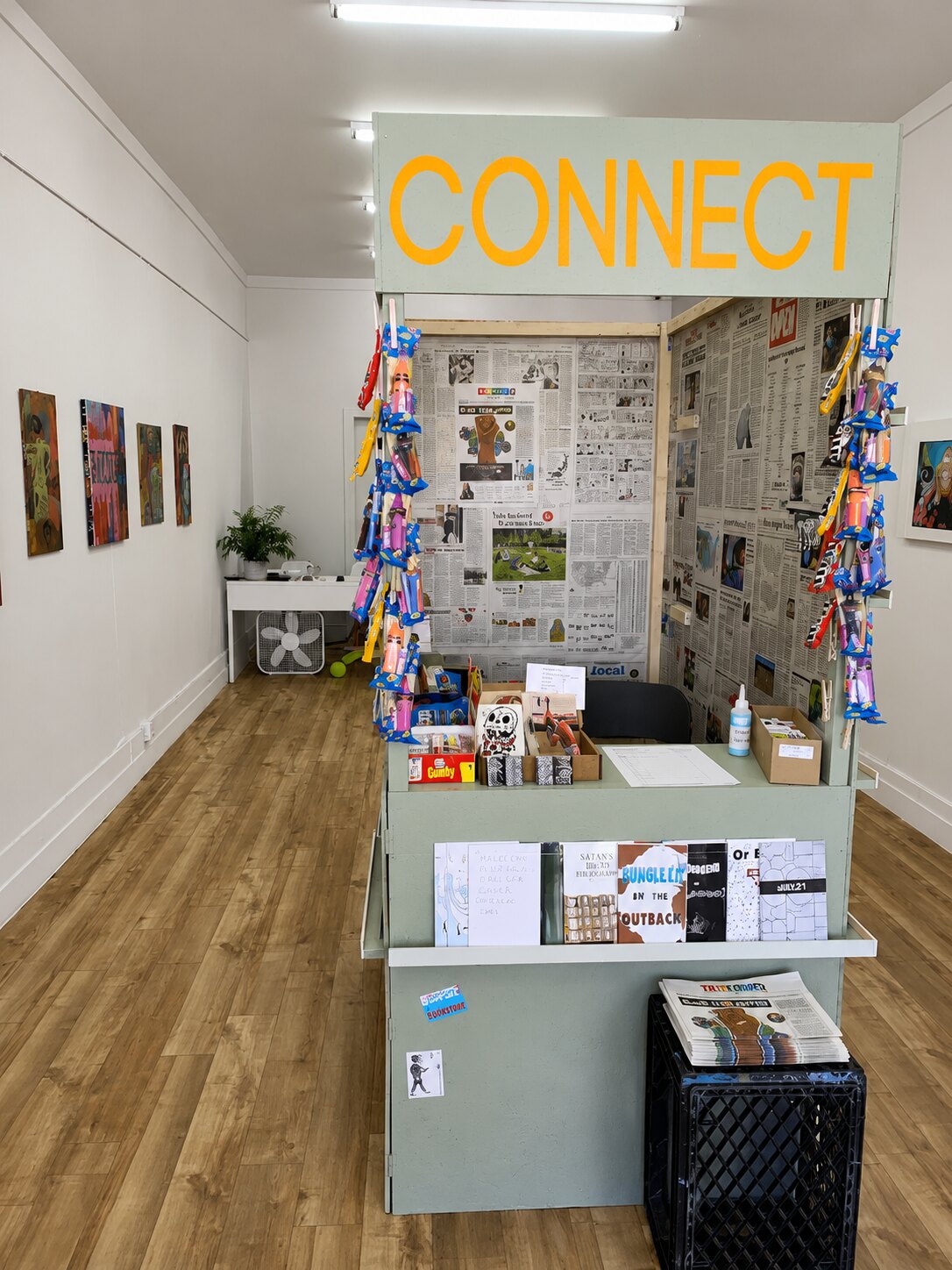 Inside the VISUAL gallery, a white-walled contemporary art space with paintings and an installation