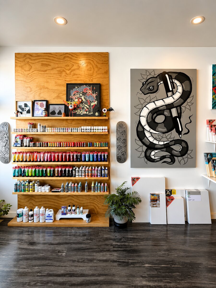 A large snake-and-pen painting on the gallery wall at VISUAL
